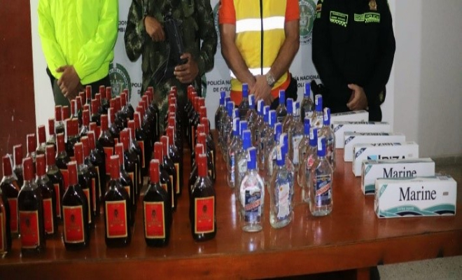 Persona capturada-policías custodiando 